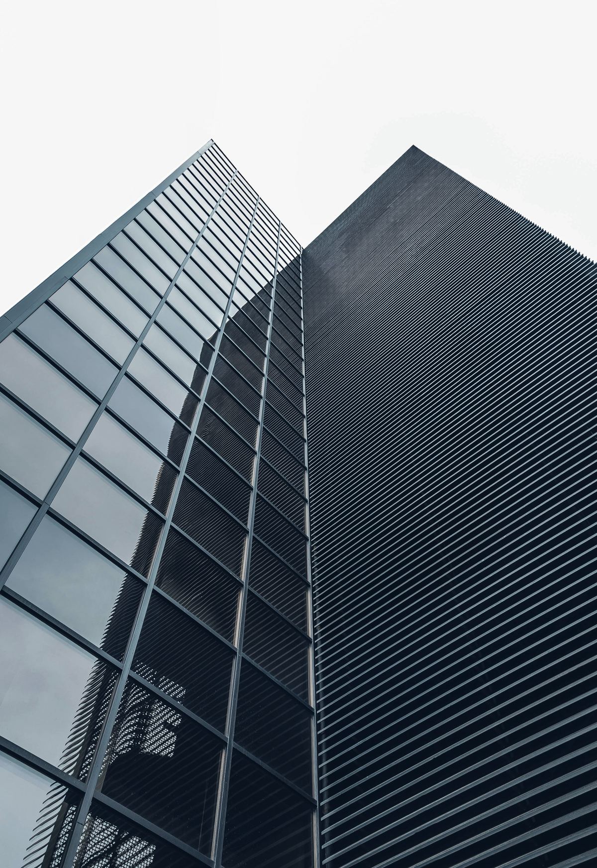 Looking up at a glass office tower